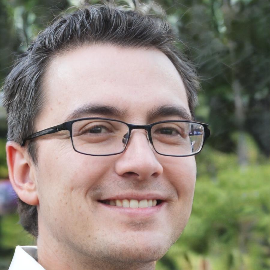 Professional headshot of male team member